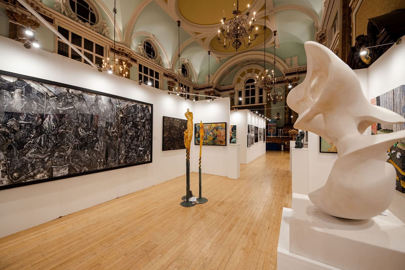The 2023 exhibition hall, hung with work on temporary white walls.