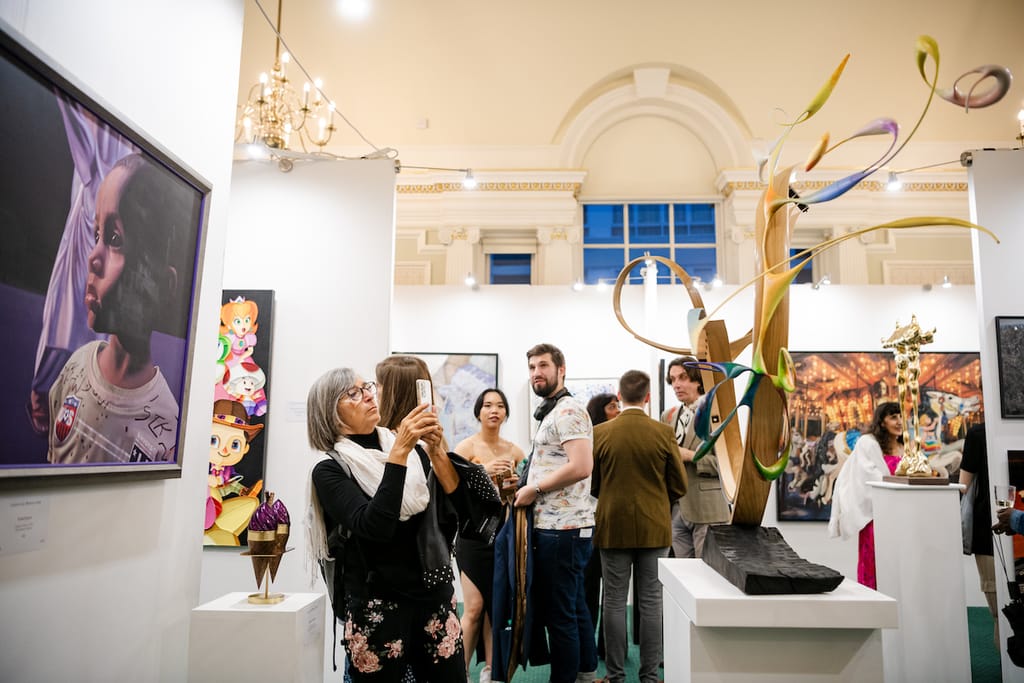 Sculpture and paintings under the chandeliers at the 2023 edition.