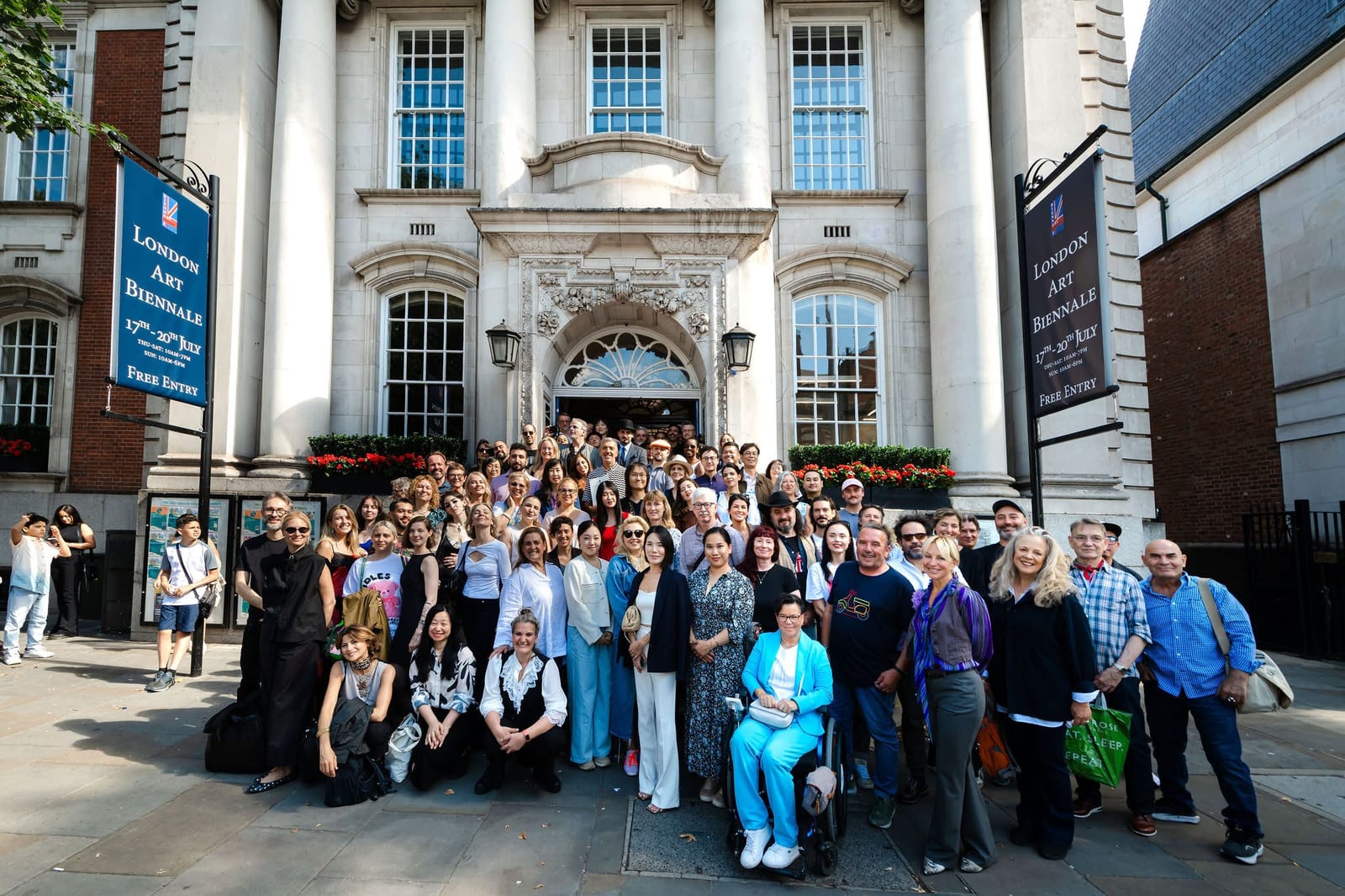A group of visitors gathered on the steps during a Biennale opening.